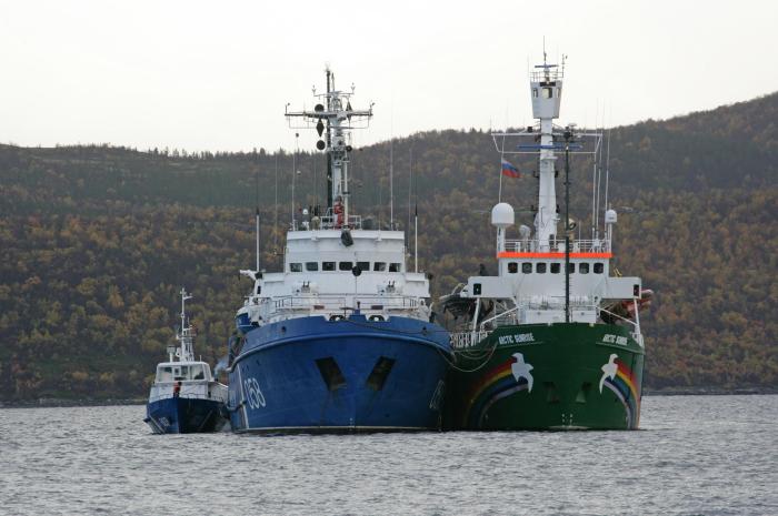 The Greenpeace ship, Arctic Sunrise is towed into Murmansk port by a Russian Coast Guard vessel. The activists onboard are facing possible charges of piracy in Russia for a protest against Arctic oil drilling in the Pechora Sea.